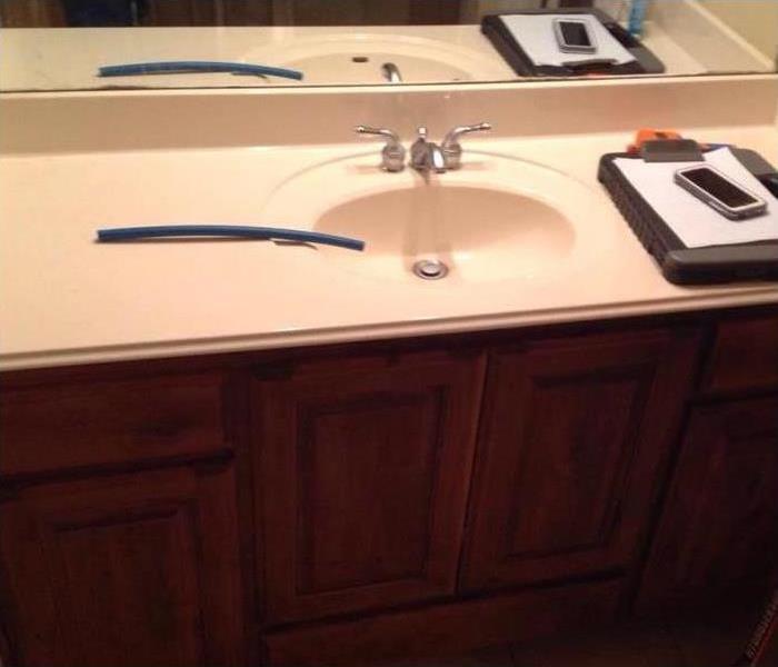 water damage in a bathroom sink