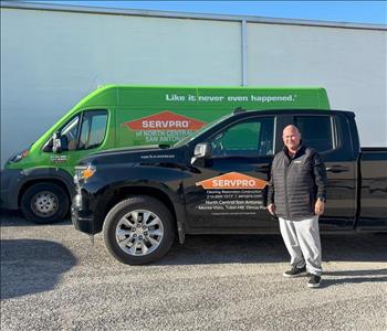 Man standing in front of a SERVPRO truck